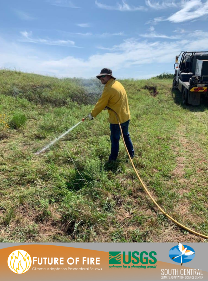 Future of Fire Climate Adaptation Postdoc Fellow Aaron Russell works in the field with a hose during a controlled burn
