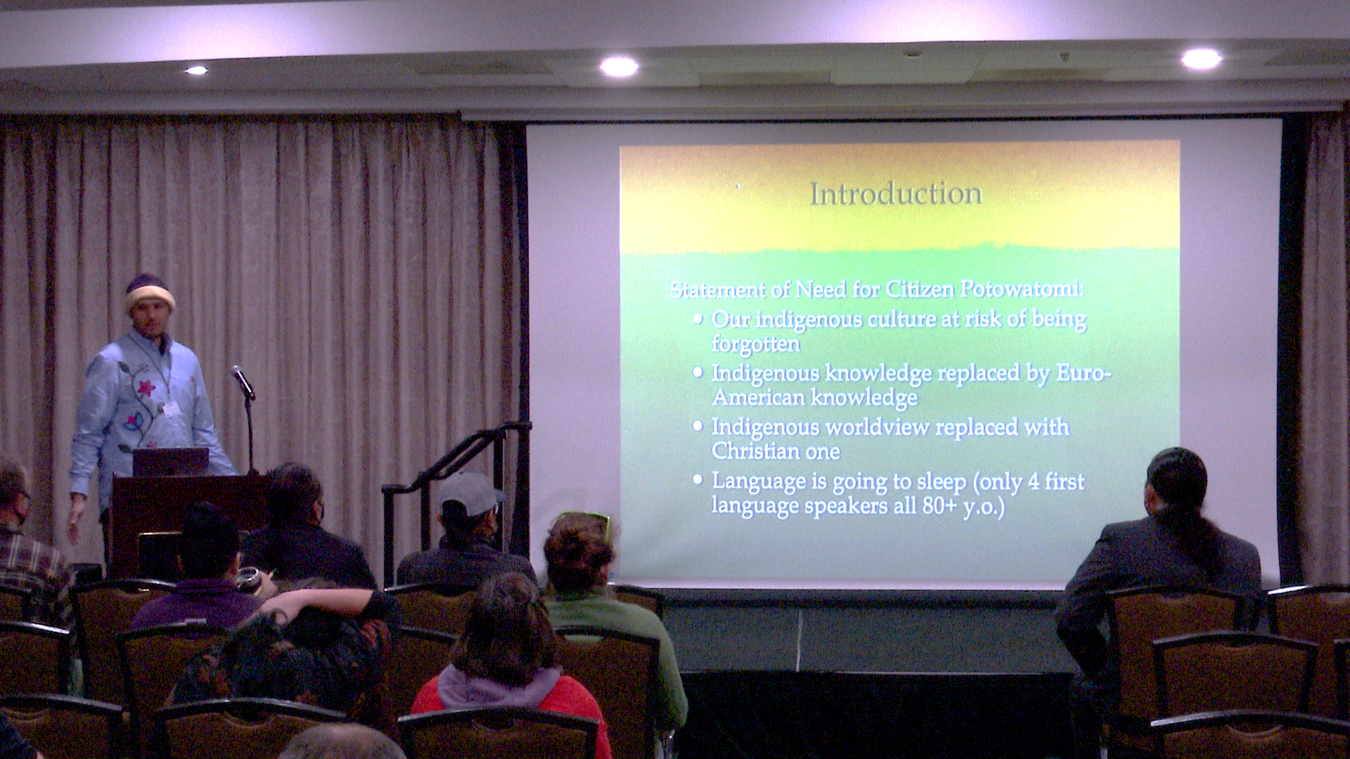 Kaya DeerInWater giving a presentation
