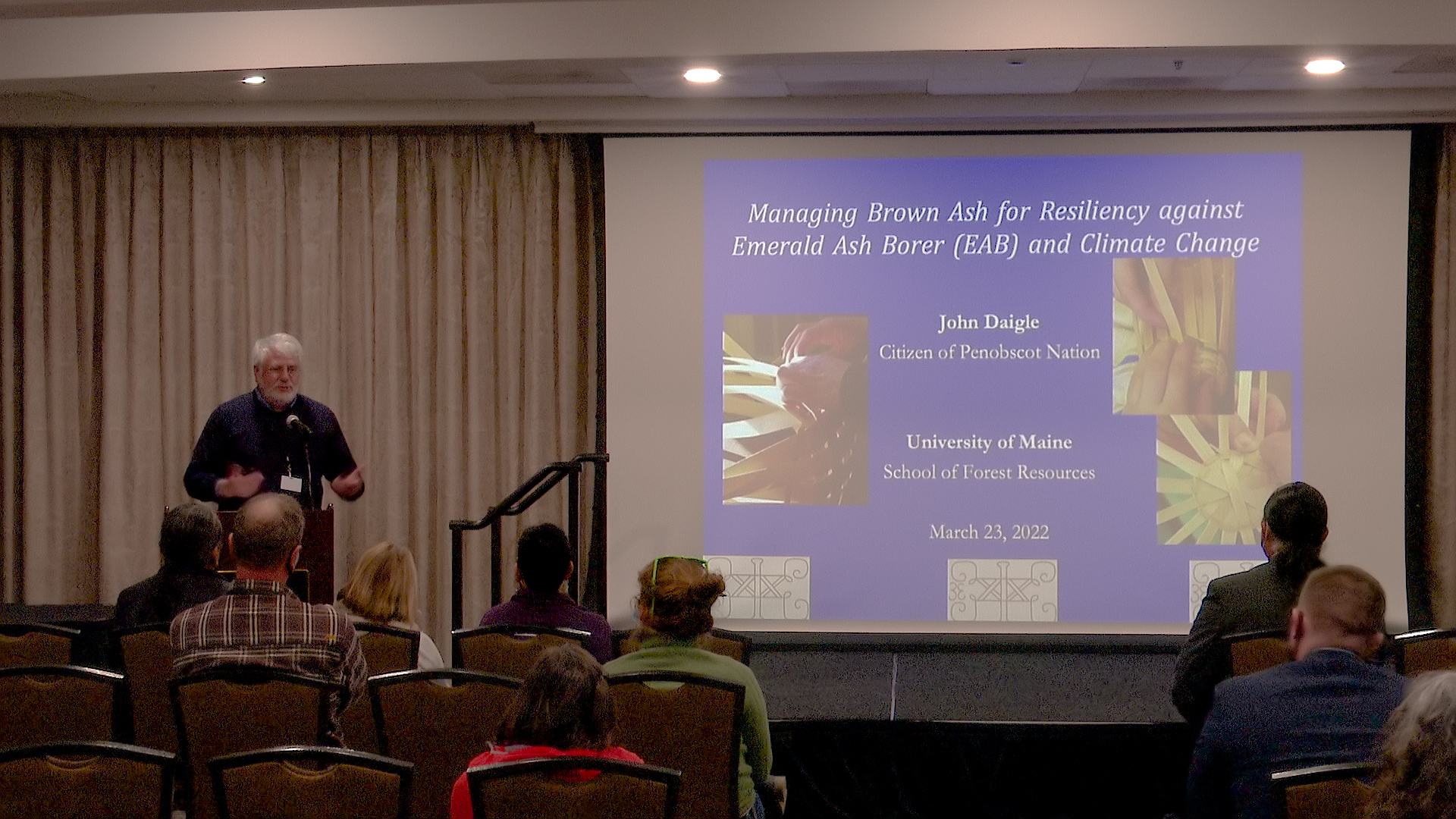 John J. Daigle giving a presentation