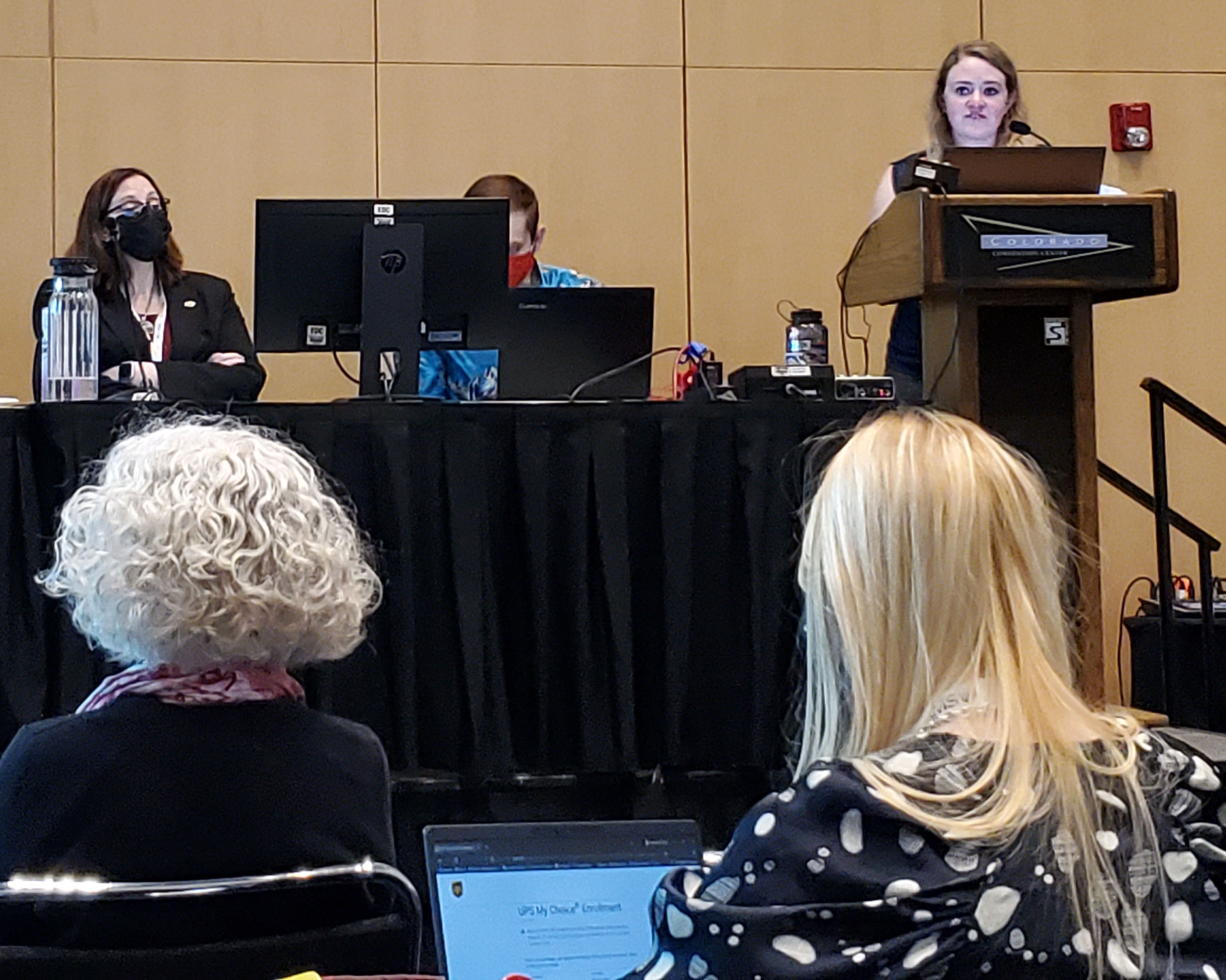 Emma Kuster speaking to an audience at AMS 2023