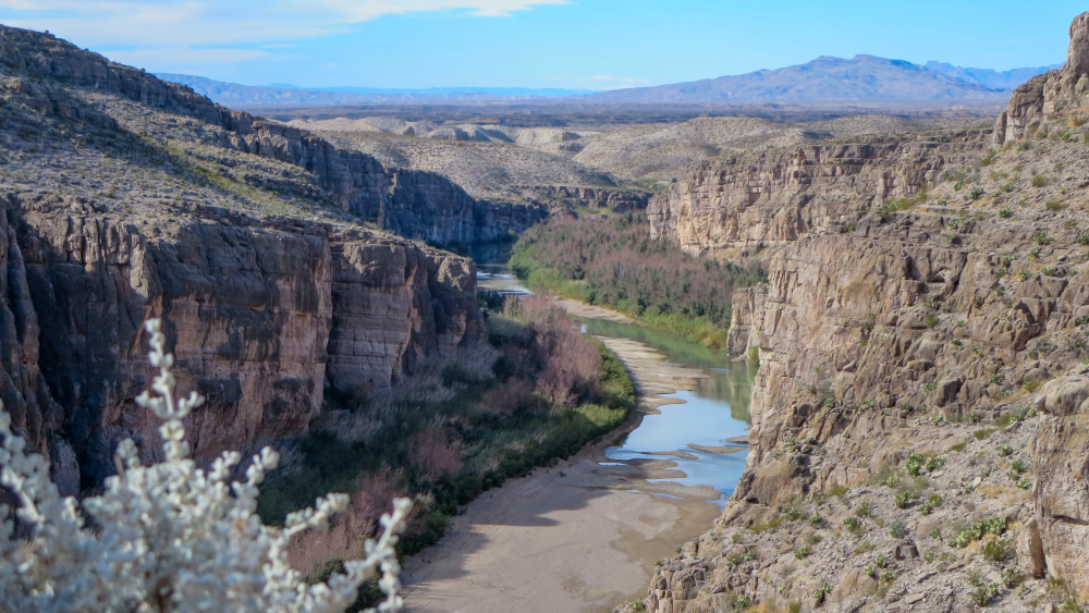 A canyon with a river running down the middle