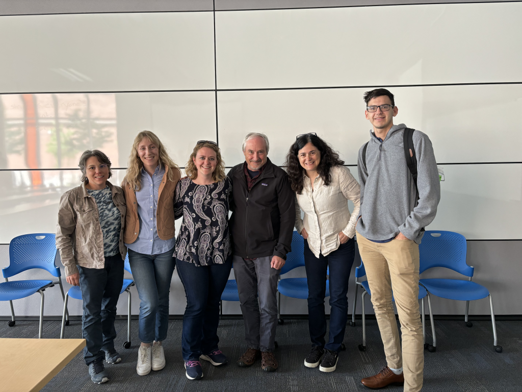 Six members of the Collaboration team pose for a group photo